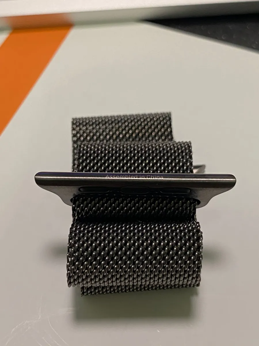 Connector end - the end near the magnetic clasp — bottom — with the words "Assembled in China"